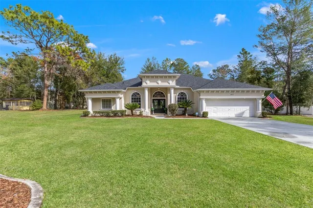 a front view of a house with a garden and porch