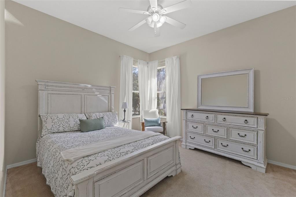 14071 Linden Drive Spring Hill, FL 34609 - Photo 32 of 77 a bedroom with a bed and a dresser