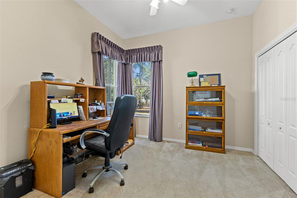 14071 Linden Drive Spring Hill, FL 34609 - Photo 40 of 77 a view of a workspace with furniture and a window