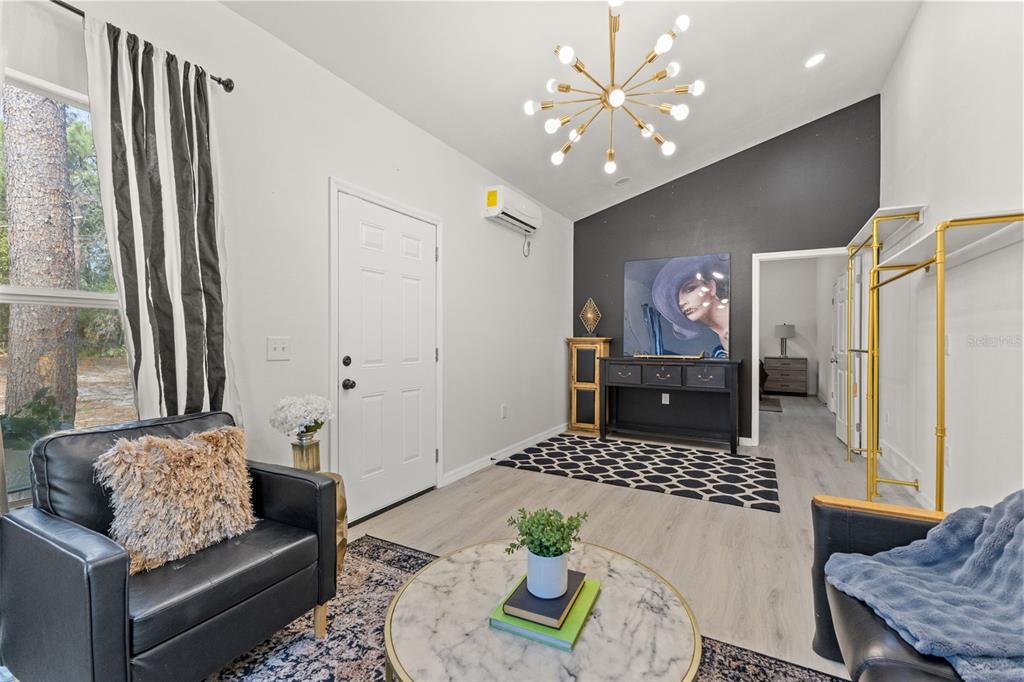 14071 Linden Drive Spring Hill, FL 34609 - Photo 56 of 77 a living room with furniture and a table