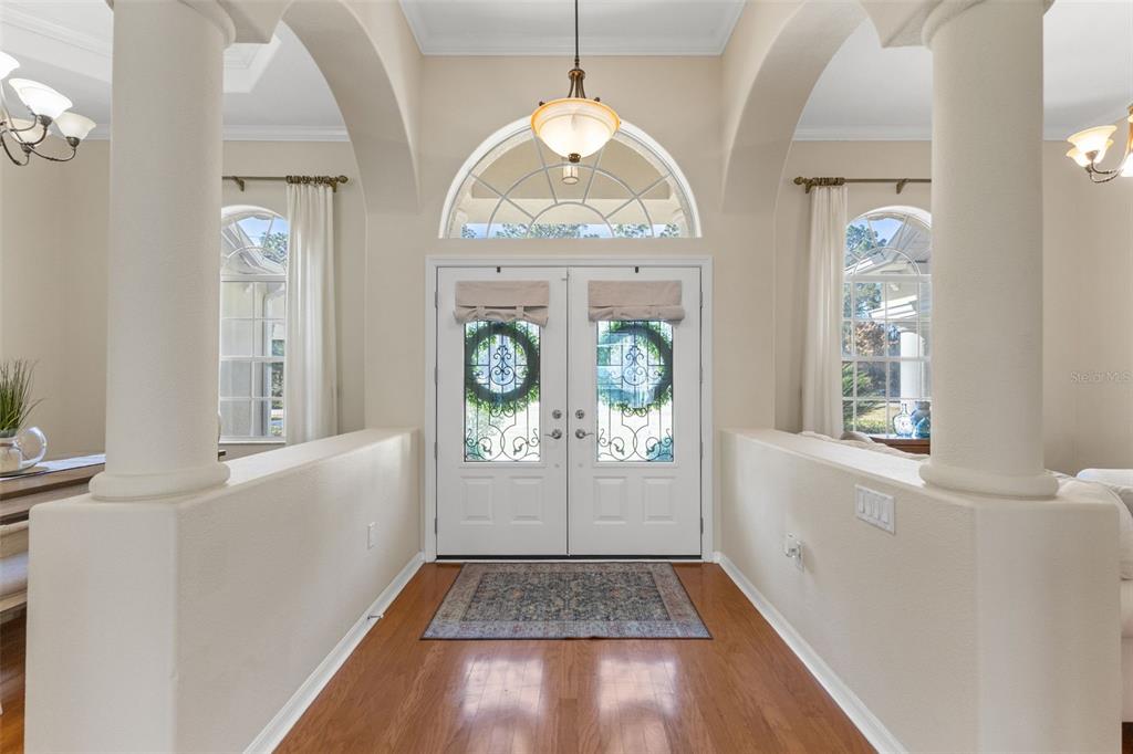 14071 Linden Drive Spring Hill, FL 34609 - Photo 6 of 77 an empty room with wooden floor fan and windows