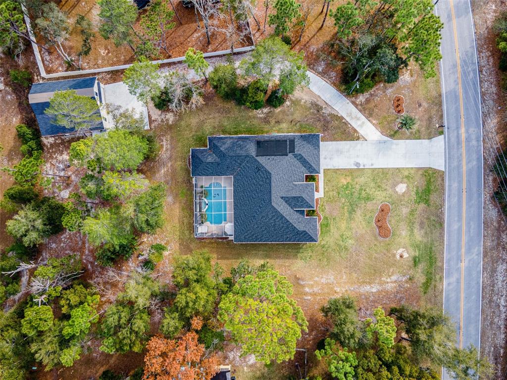 14071 Linden Drive Spring Hill, FL 34609 - Photo 66 of 77 an aerial view of a house with yard swimming pool and outdoor seating