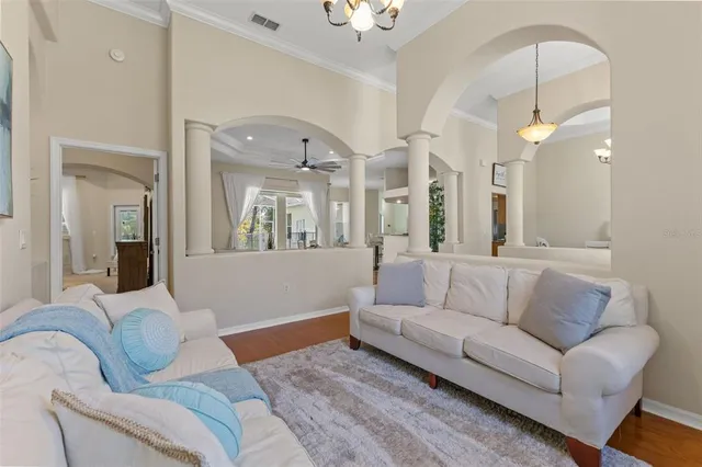 a living room with furniture and a large mirror