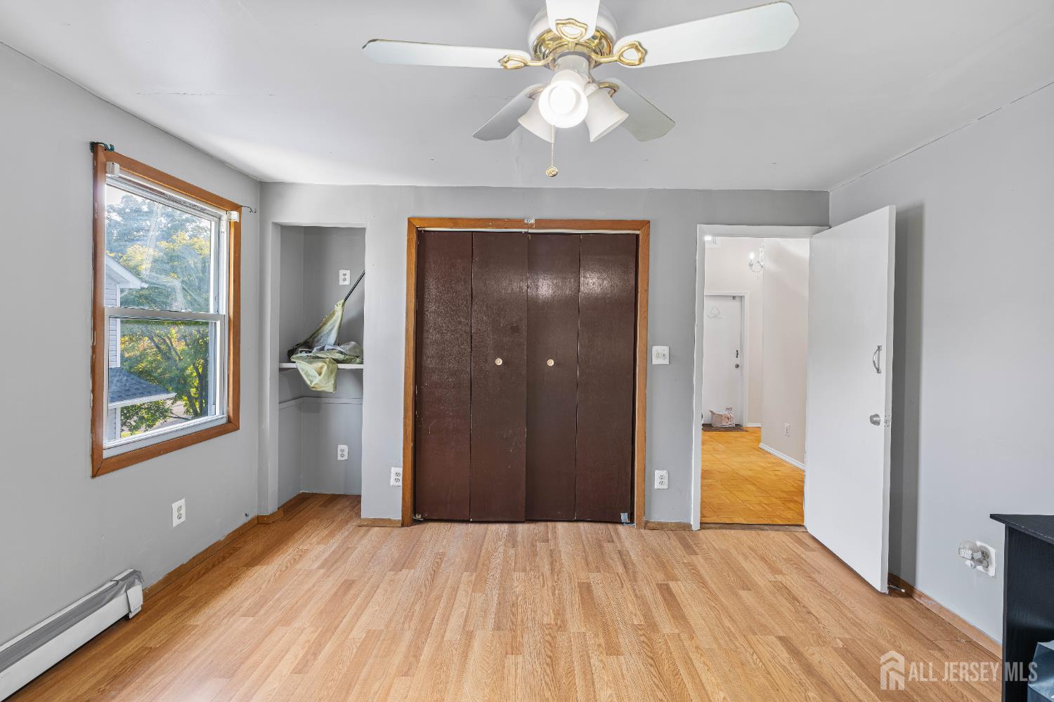 651 Fairview Avenue Piscataway, NJ 08854 - Photo 15 of 45 wooden floor in an empty room with a window
