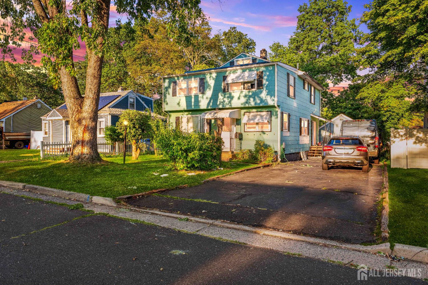 651 Fairview Avenue Piscataway, NJ 08854 - Photo 2 of 45 a front view of a building with a garden and trees