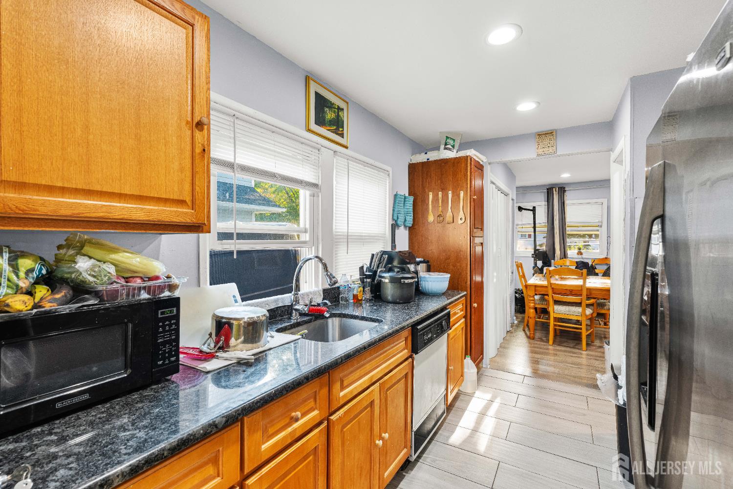 651 Fairview Avenue Piscataway, NJ 08854 - Photo 22 of 45 a kitchen with stainless steel appliances granite countertop a sink and a refrigerator