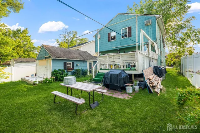 a view of a house with a yard porch and sitting area
