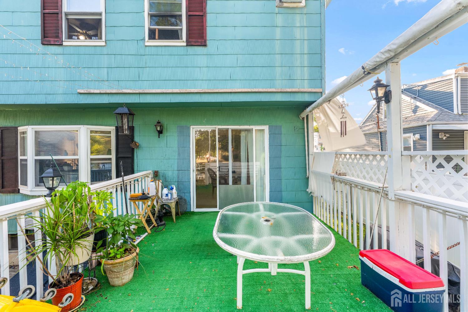 651 Fairview Avenue Piscataway, NJ 08854 - Photo 33 of 45 a front view of a house with a chairs and table in a patio
