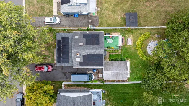 an aerial view of a house with a garden and plants