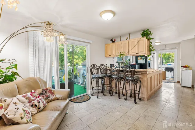 a living room with furniture flowerpot and a dining table