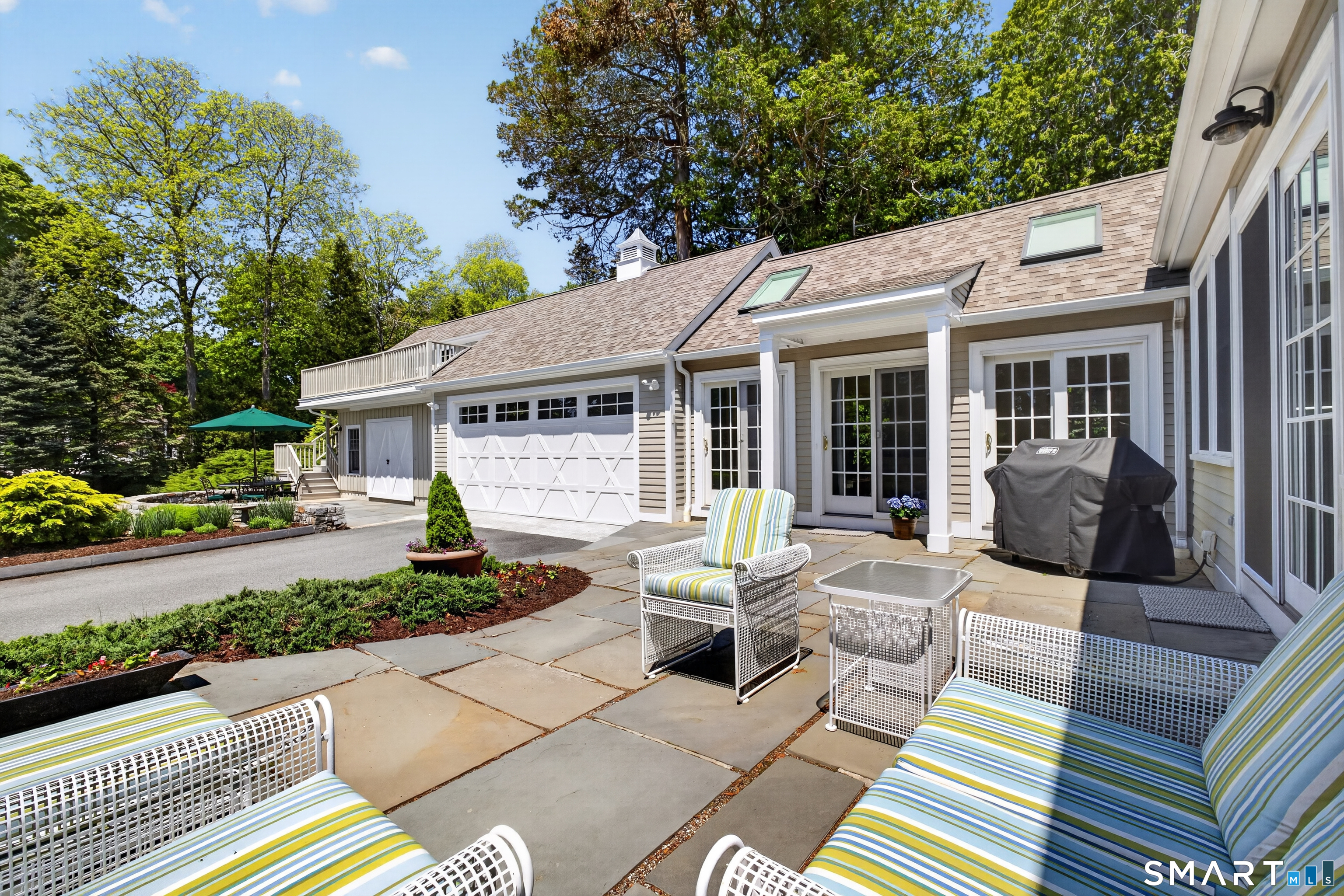 10 Prospect Street Groton, CT 06355 - Photo 21 of 40 a view of a patio with couches table and chairs and potted plants