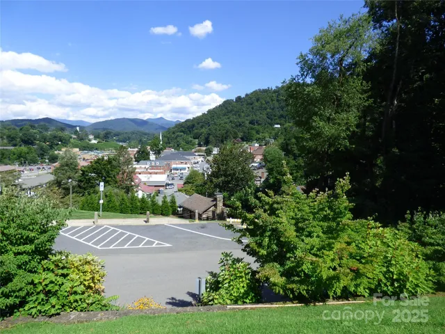 a view of a street with a yard