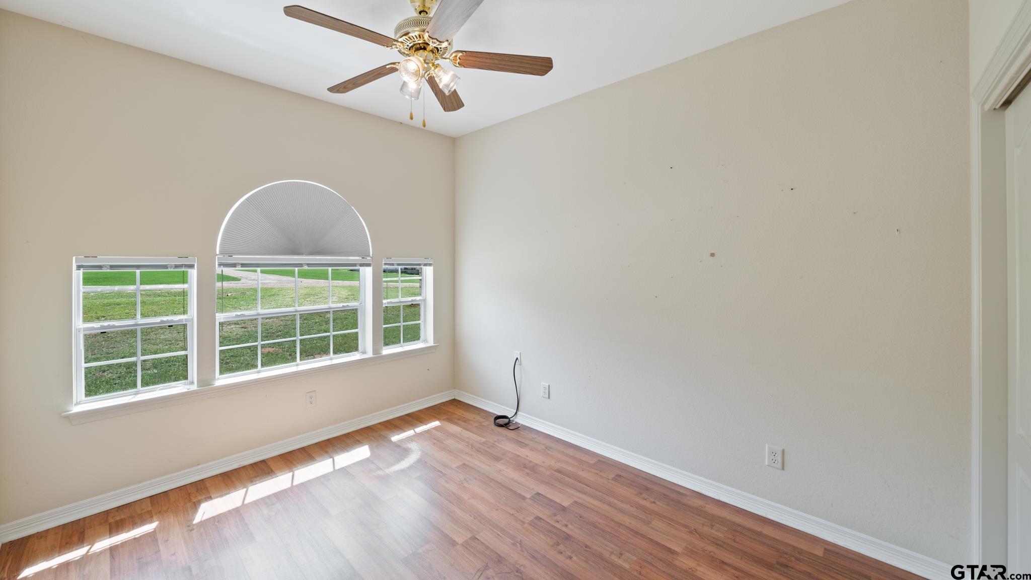 291 VZ County Road Canton, TX 75103 - Photo 17 of 42 a view of an empty room with a window and wooden floor