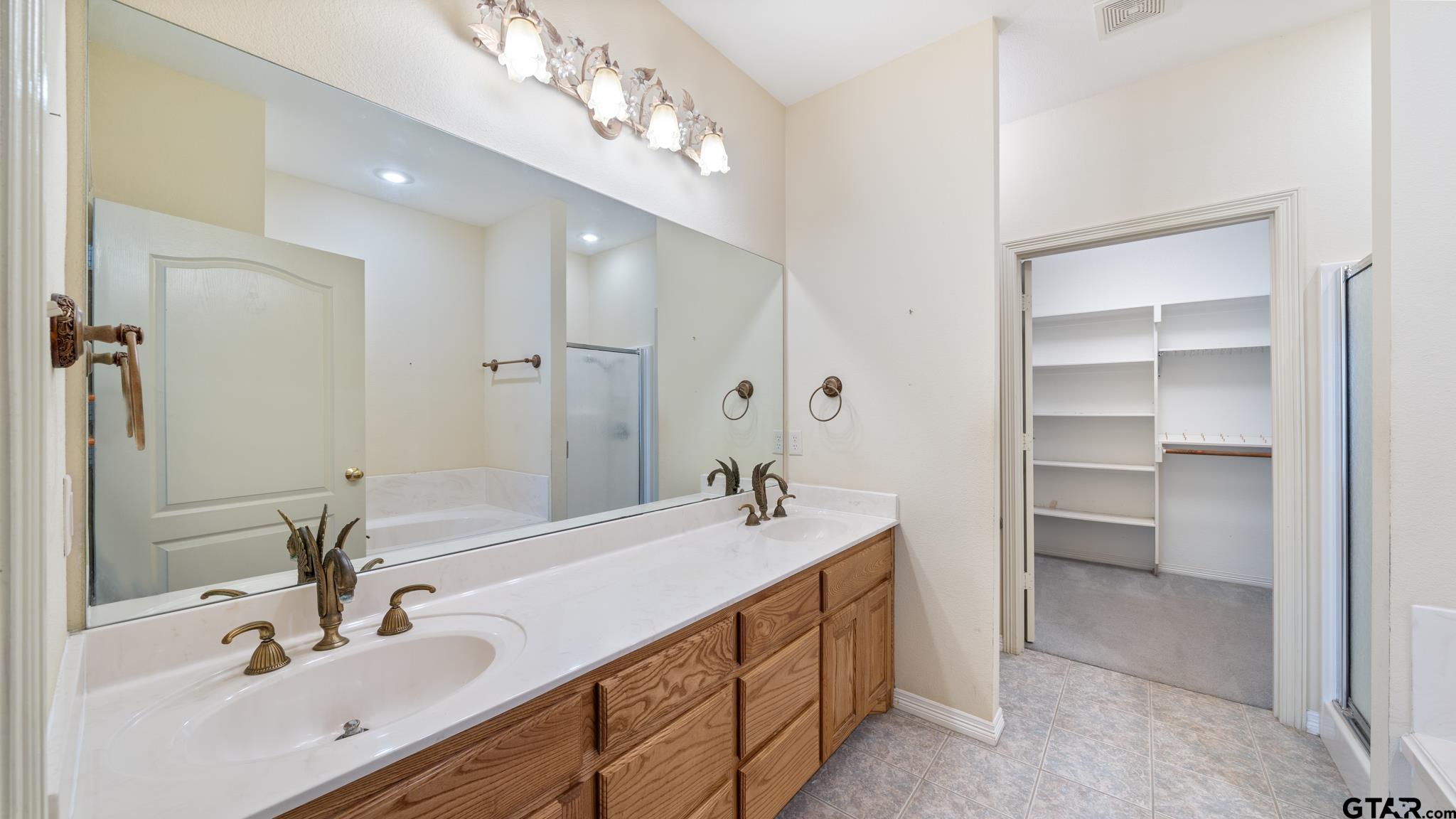291 VZ County Road Canton, TX 75103 - Photo 21 of 42 a bathroom with a double vanity sink mirror and double