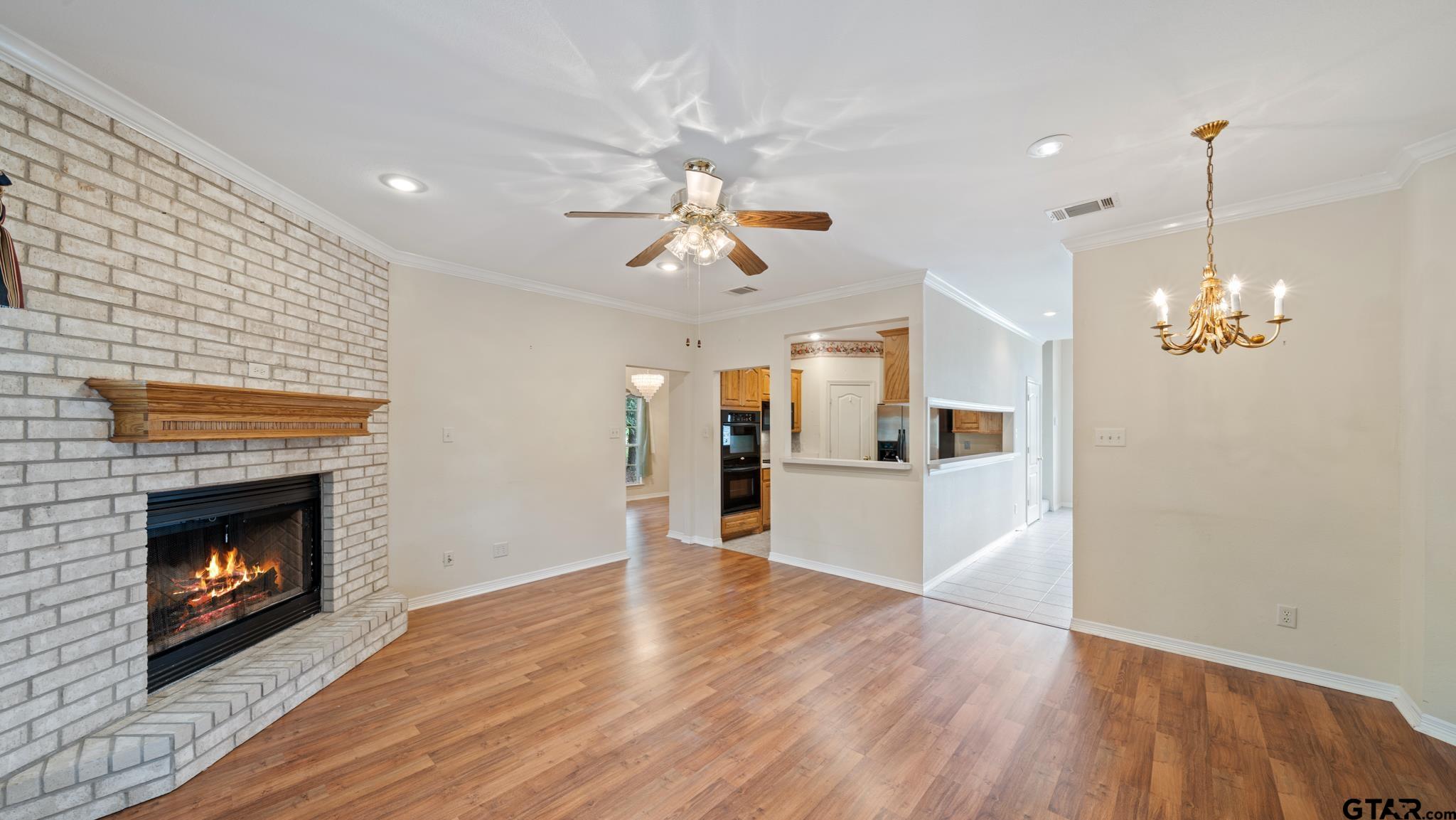 291 VZ County Road Canton, TX 75103 - Photo 10 of 42 a view of a kitchen with a sink a fireplace and wooden floor