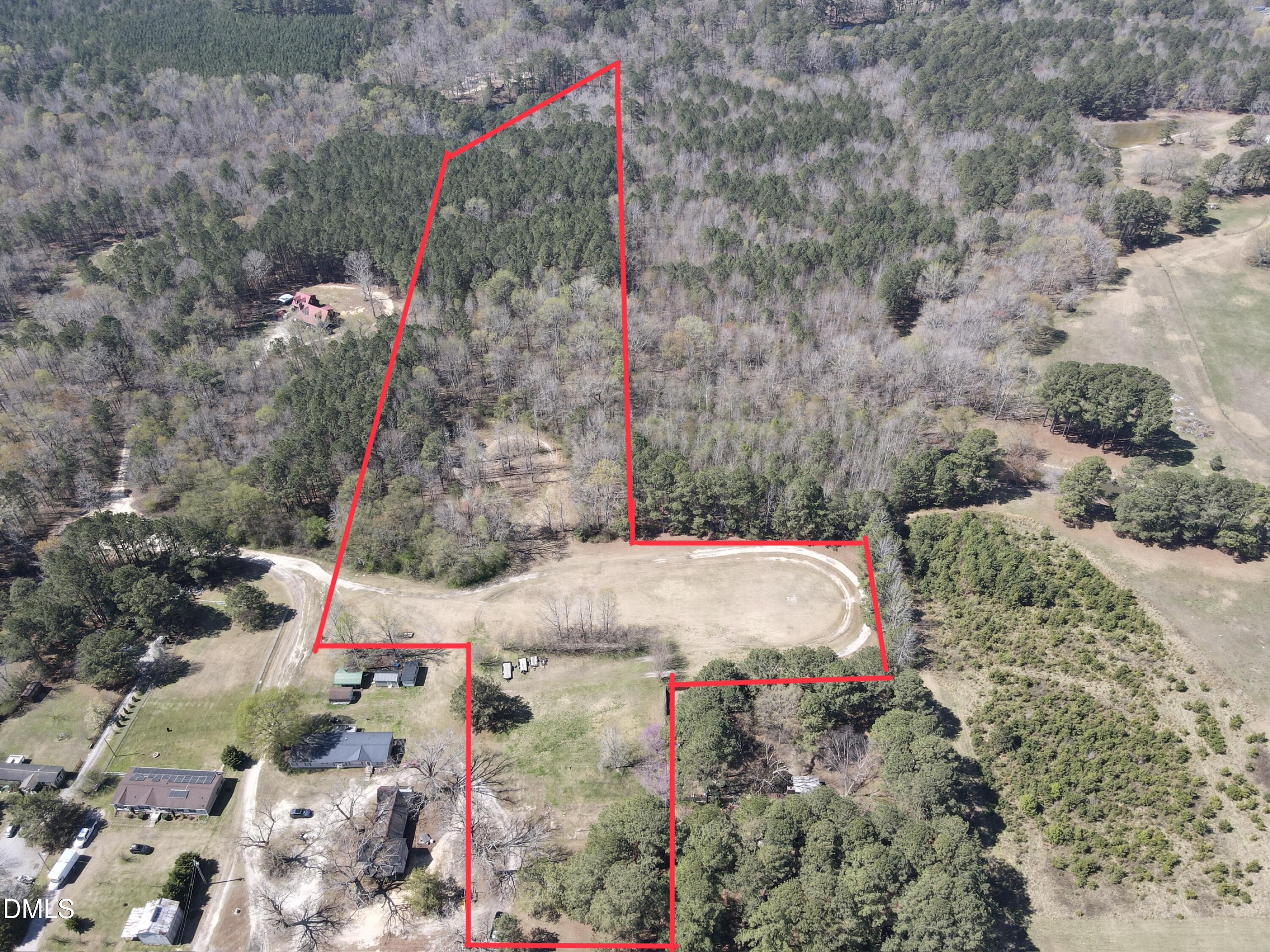 a backyard of a house with a yard and fountain