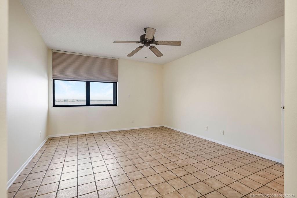 1950 Southwest Palm City Road, Unit 14302 Stuart, FL 34994 - Photo 28 of 62 a view of an empty room with windows