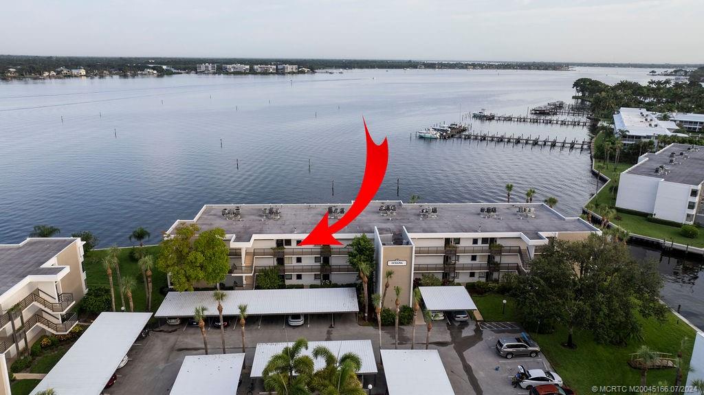 1950 Southwest Palm City Road, Unit 14302 Stuart, FL 34994 - Photo 33 of 62 an aerial view of a house with a lake