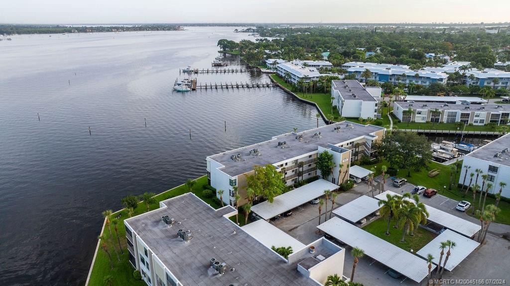 1950 Southwest Palm City Road, Unit 14302 Stuart, FL 34994 - Photo 35 of 62 an aerial view of a house with a lake view