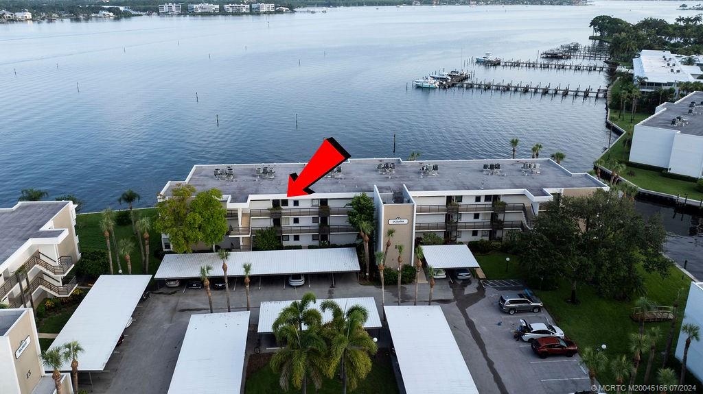 1950 Southwest Palm City Road, Unit 14302 Stuart, FL 34994 - Photo 38 of 62 an aerial view of a house with swimming pool and patio