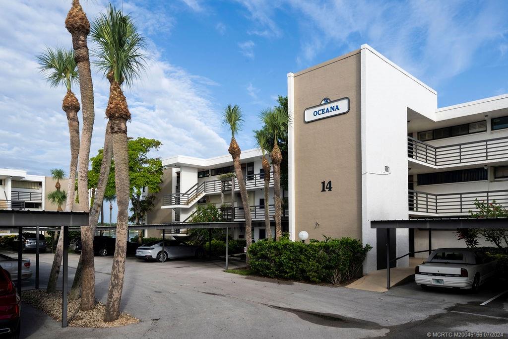 1950 Southwest Palm City Road, Unit 14302 Stuart, FL 34994 - Photo 39 of 62 a car parked in front of building