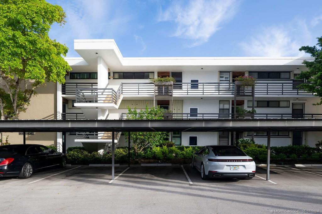1950 Southwest Palm City Road, Unit 14302 Stuart, FL 34994 - Photo 41 of 62 a car parked in front of a building