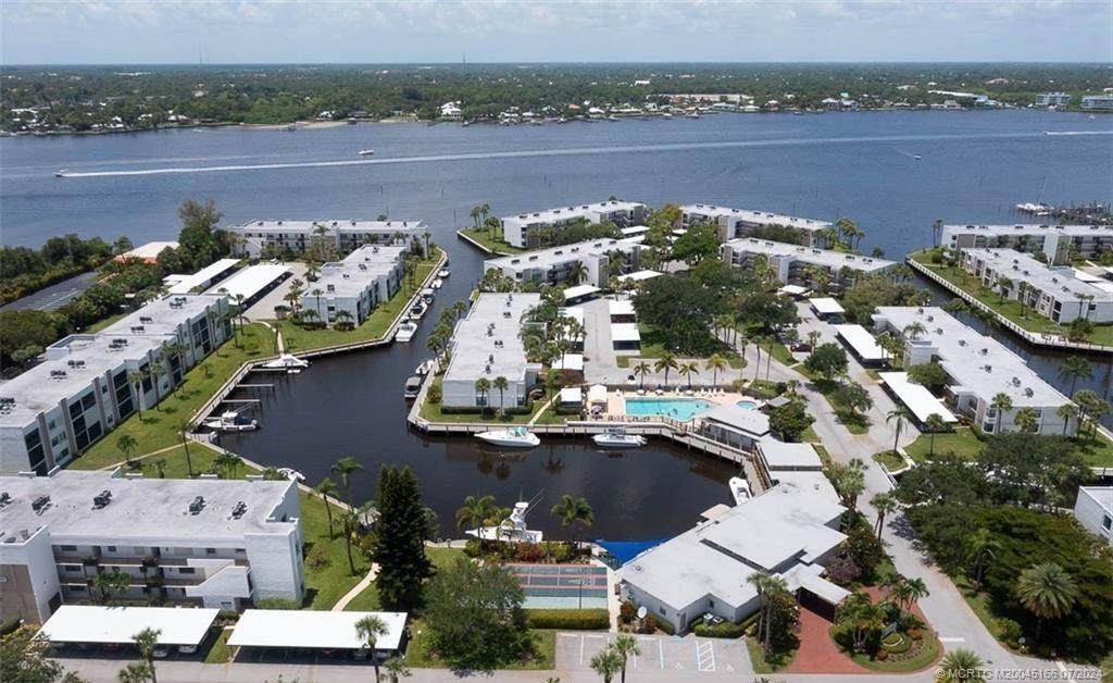 1950 Southwest Palm City Road, Unit 14302 Stuart, FL 34994 - Photo 43 of 62 an aerial view of a houses with outdoor space