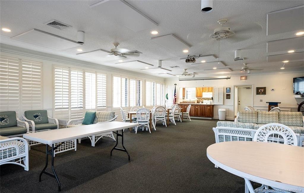 1950 Southwest Palm City Road, Unit 14302 Stuart, FL 34994 - Photo 48 of 62 a view of a dining room with furniture window and outside view