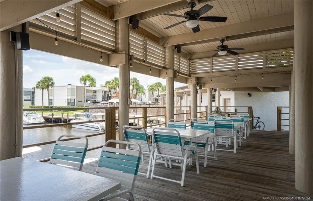 1950 Southwest Palm City Road, Unit 14302 Stuart, FL 34994 - Photo 53 of 62 a view of a dining room with furniture window and outside view