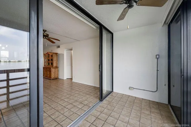 a kitchen with granite countertop a refrigerator stove and microwave