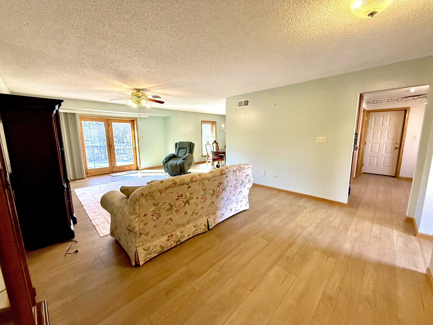 8408 49th Street Coal Valley, IL 61240 - Photo 20 of 43 a living room with a bed furniture and a large window