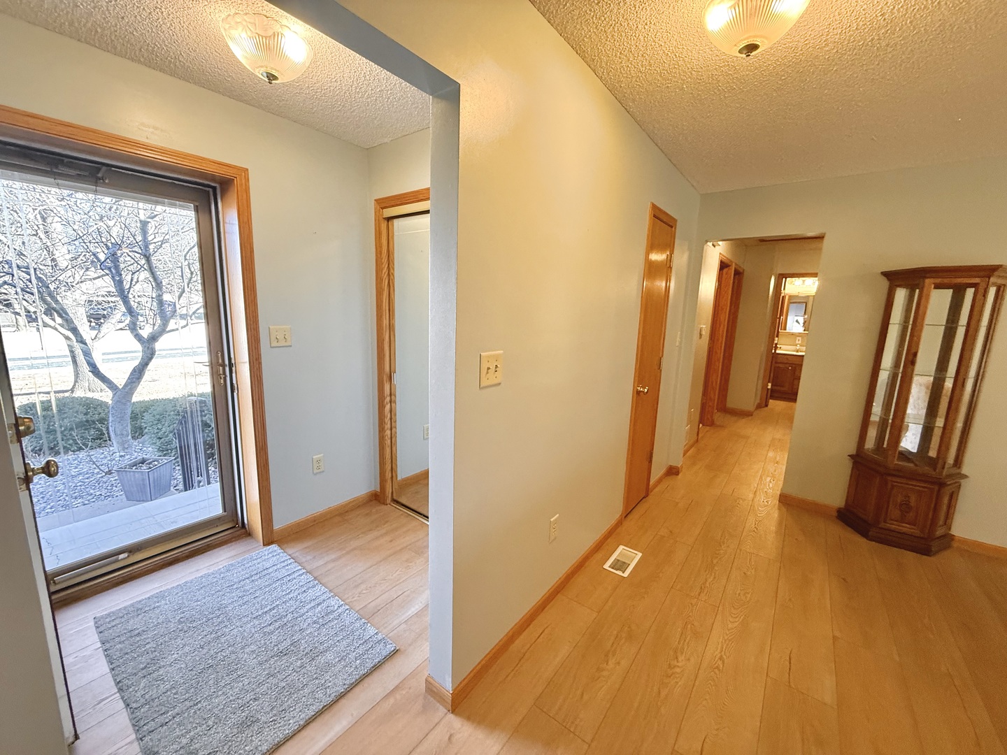 8408 49th Street Coal Valley, IL 61240 - Photo 23 of 43 a view of a hallway with wooden floor and glass door