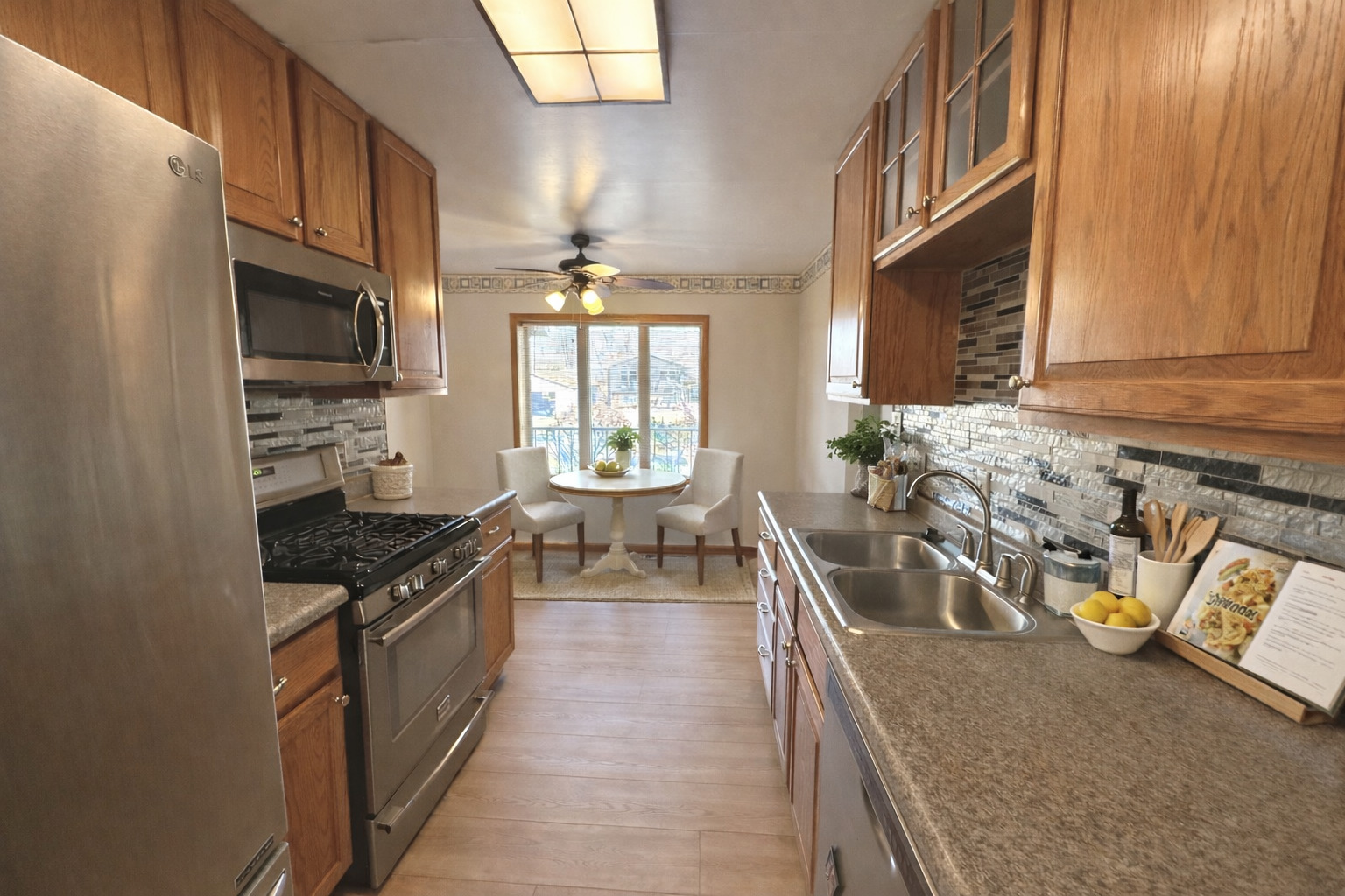 8408 49th Street Coal Valley, IL 61240 - Photo 5 of 43 a kitchen with stainless steel appliances granite countertop a sink stove and refrigerator