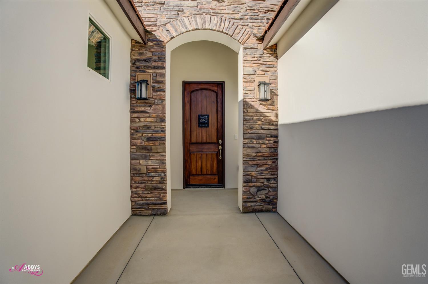 Undisclosed Address Bakersfield, CA 93306 - Photo 7 of 51 a view of empty room with staircase