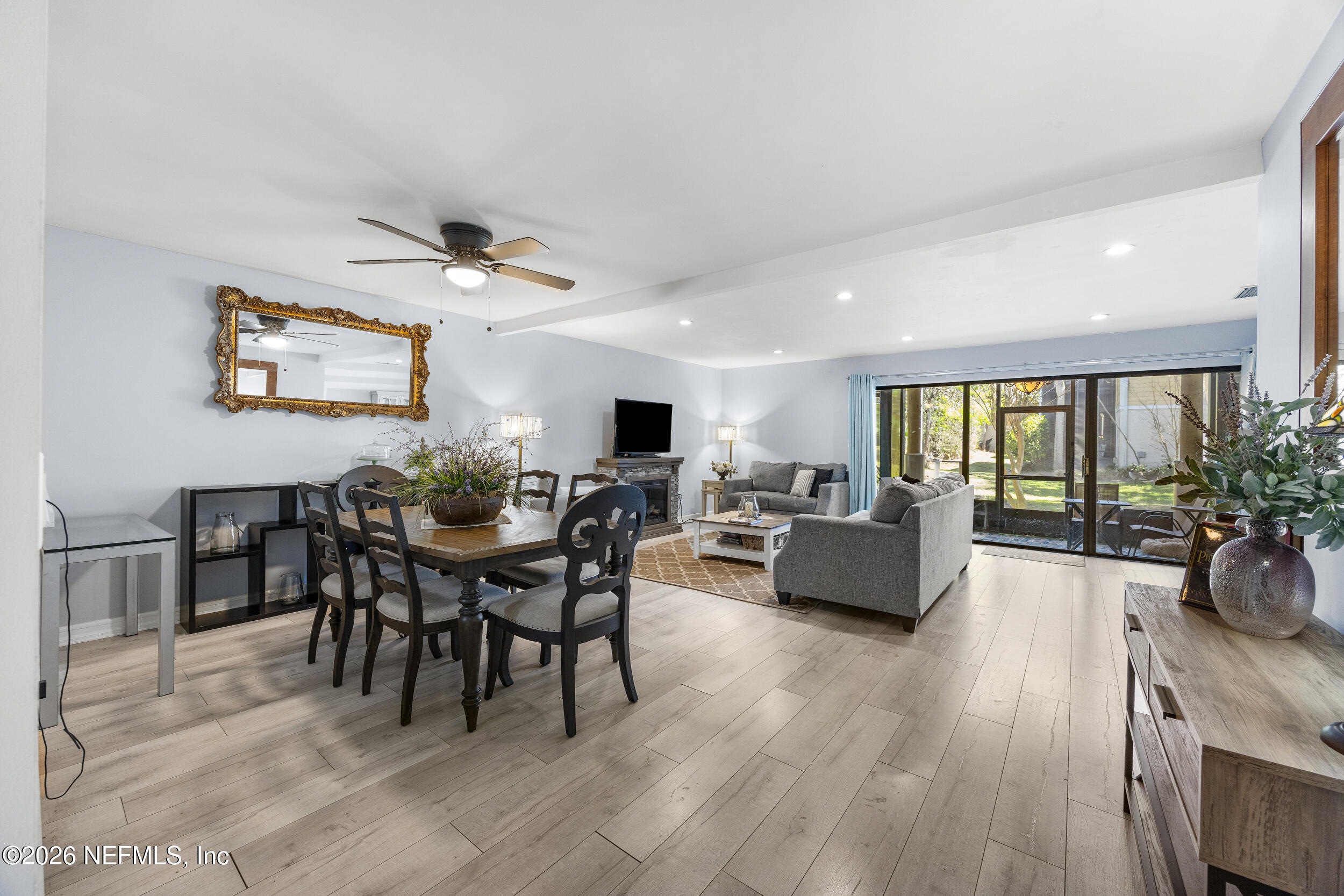 7852 Playa Del Rey Court Jacksonville, FL 32256 - Photo 11 of 33 a view of a dining room with furniture window and wooden floor