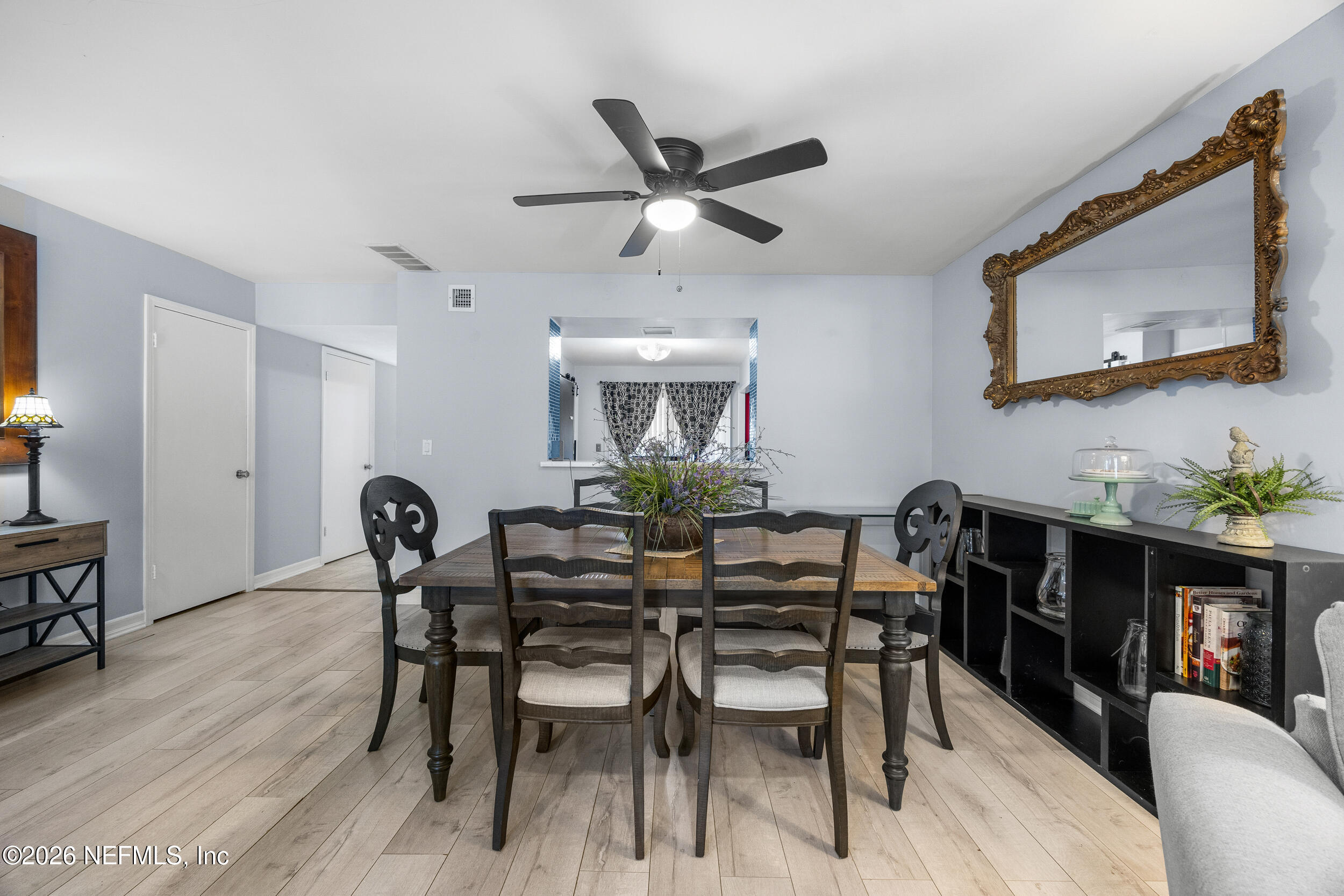 7852 Playa Del Rey Court Jacksonville, FL 32256 - Photo 12 of 33 a dining room with furniture and window