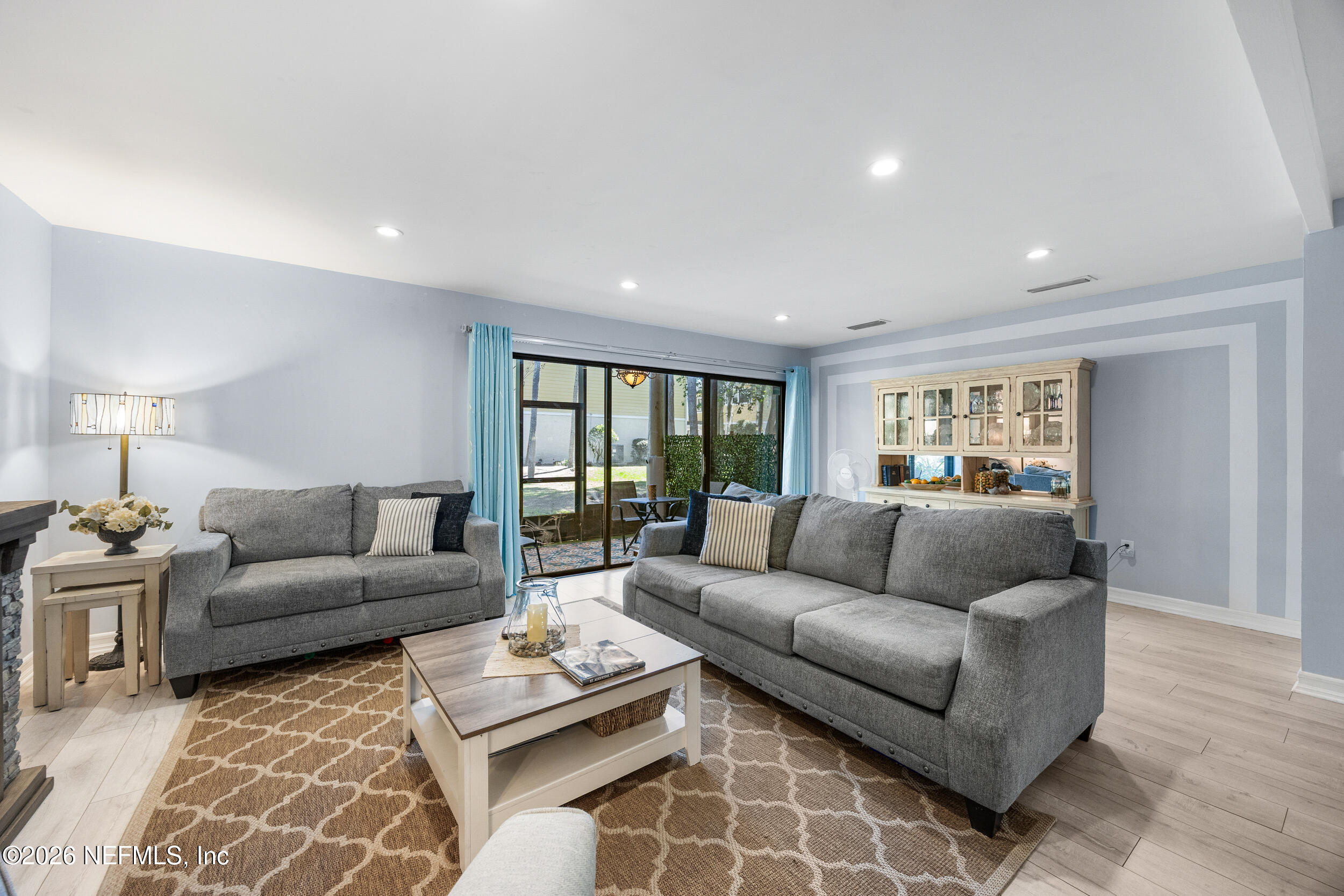 7852 Playa Del Rey Court Jacksonville, FL 32256 - Photo 13 of 33 a living room with furniture and a couch
