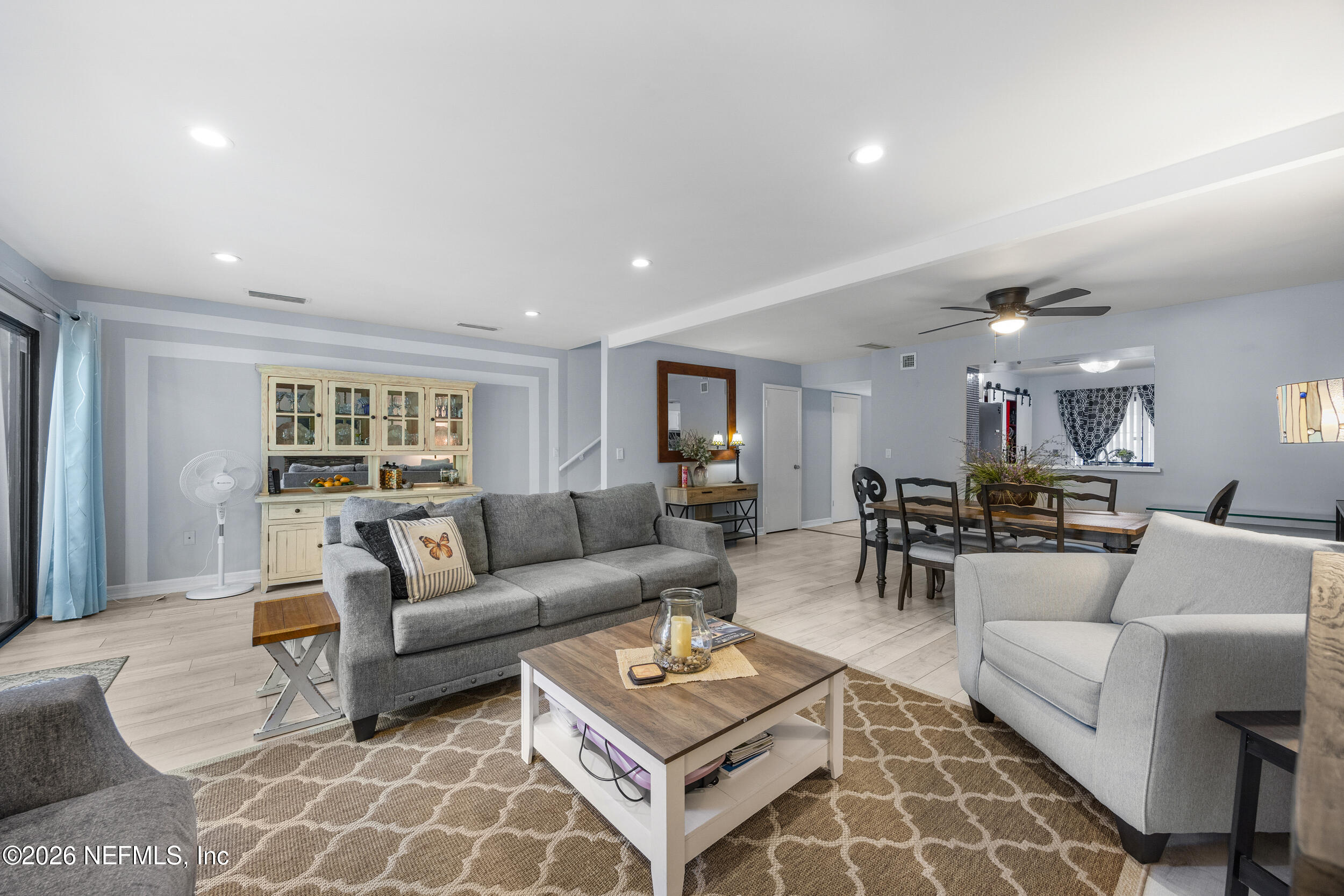 7852 Playa Del Rey Court Jacksonville, FL 32256 - Photo 15 of 33 a living room with furniture and a table