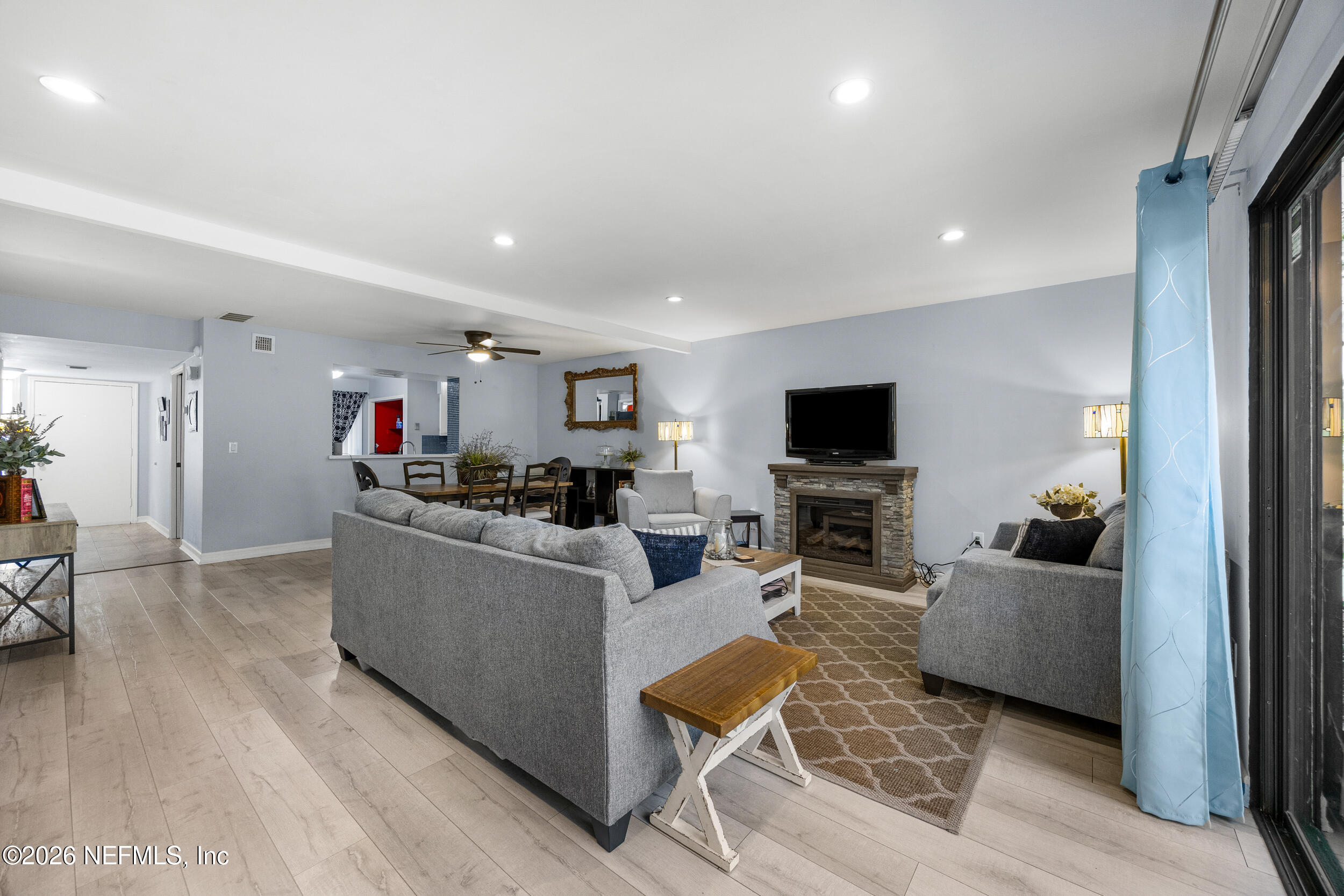 7852 Playa Del Rey Court Jacksonville, FL 32256 - Photo 16 of 33 a living room with furniture and a flat screen tv