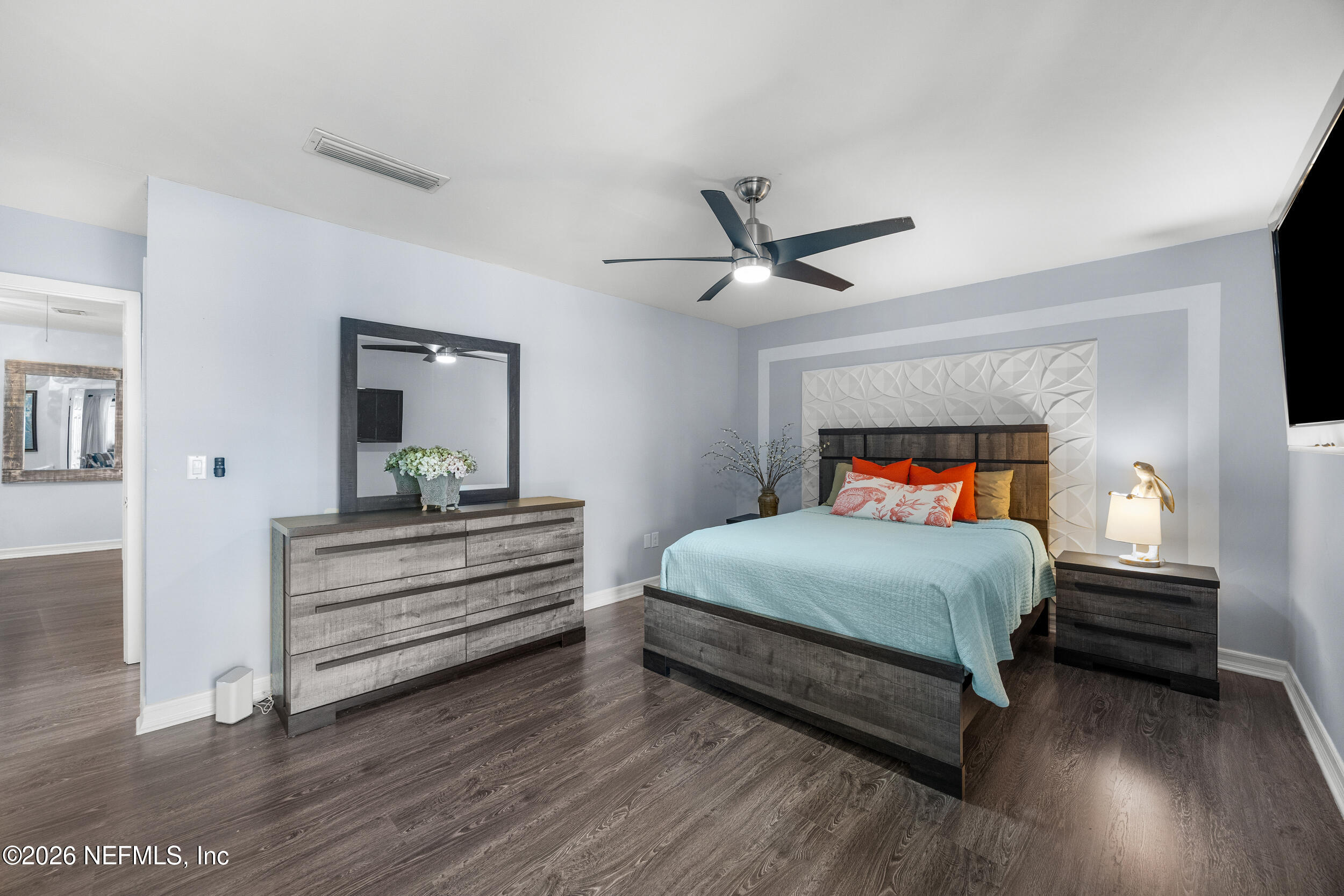 7852 Playa Del Rey Court Jacksonville, FL 32256 - Photo 18 of 33 a bedroom with a bed and a ceiling fan