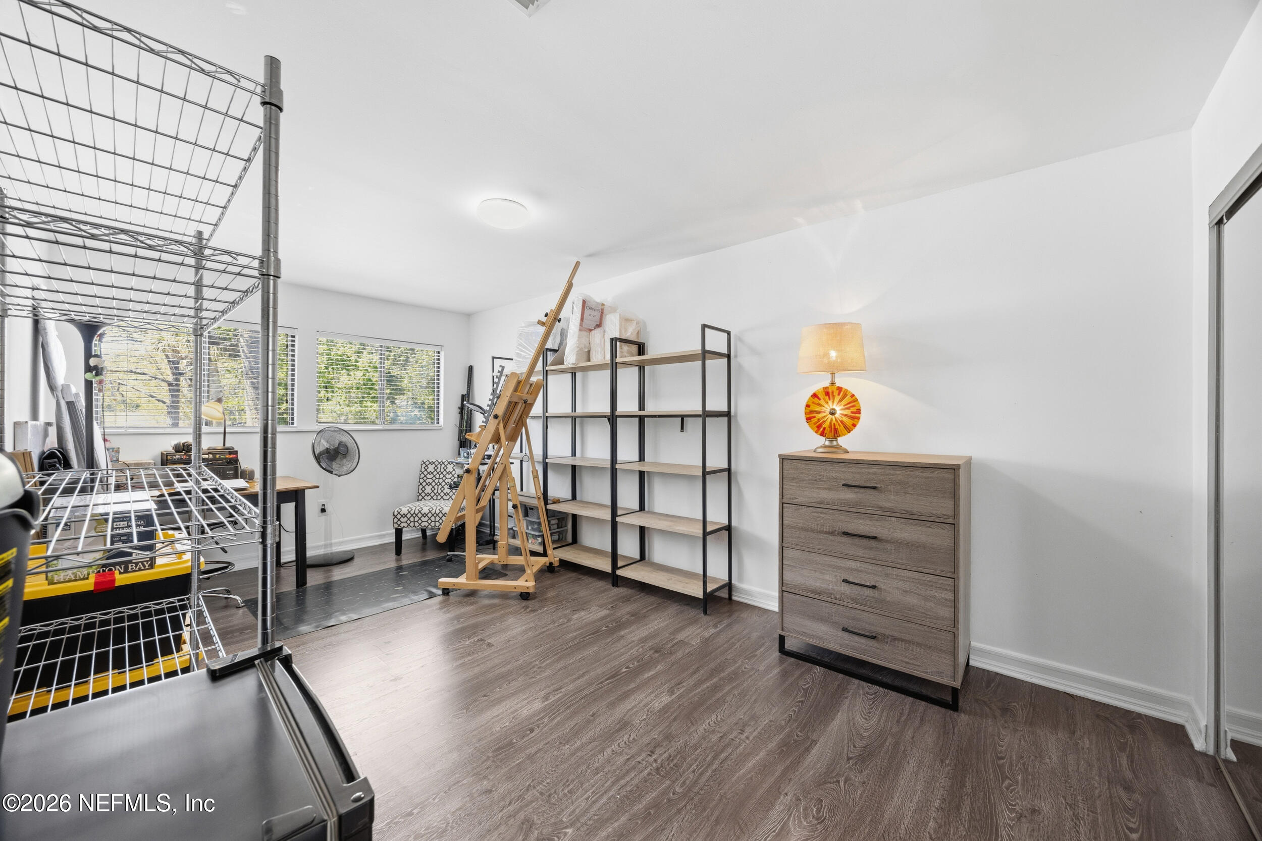 7852 Playa Del Rey Court Jacksonville, FL 32256 - Photo 23 of 33 a view of a bedroom with furniture and windows