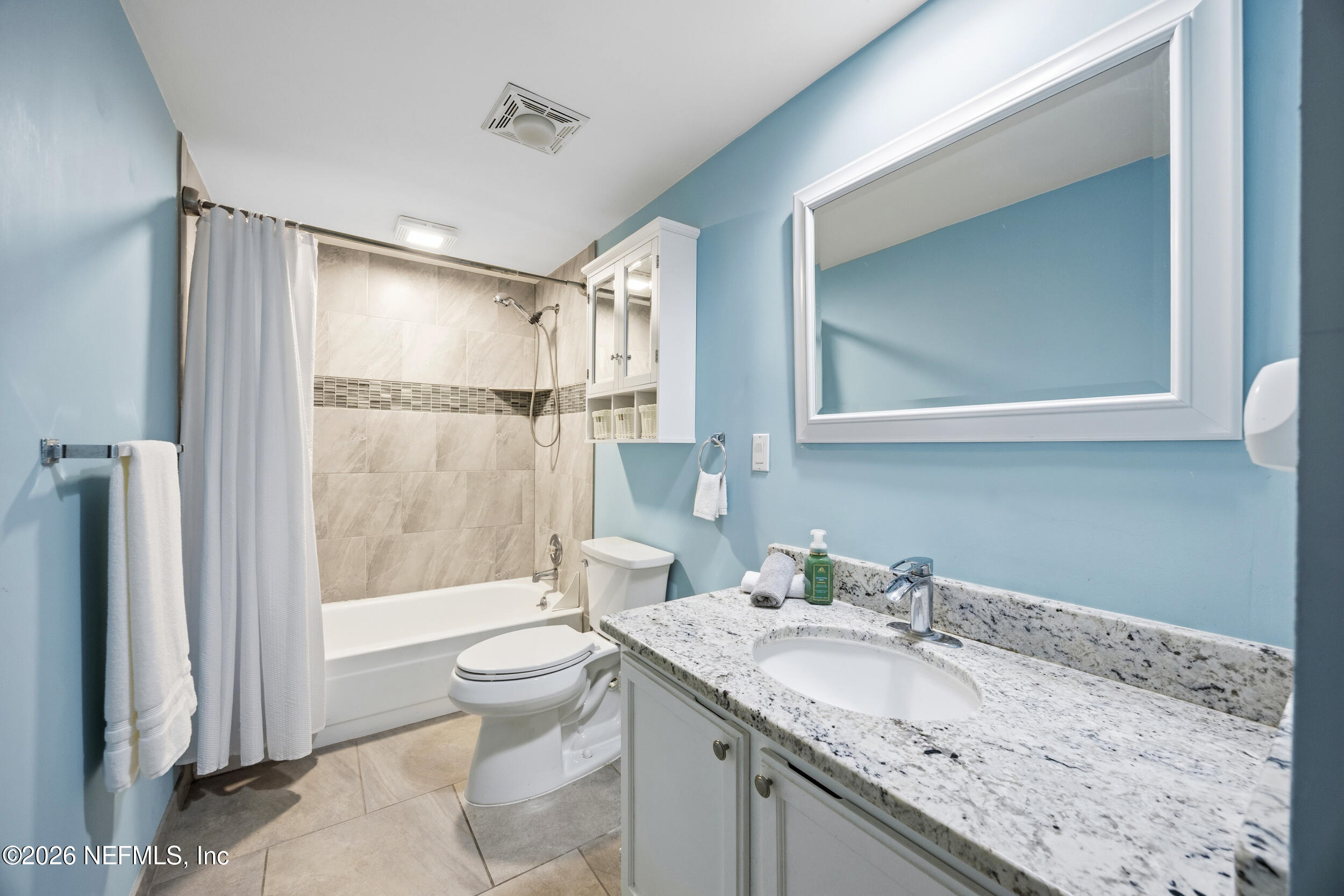 7852 Playa Del Rey Court Jacksonville, FL 32256 - Photo 24 of 33 a bathroom with a granite countertop sink toilet and shower
