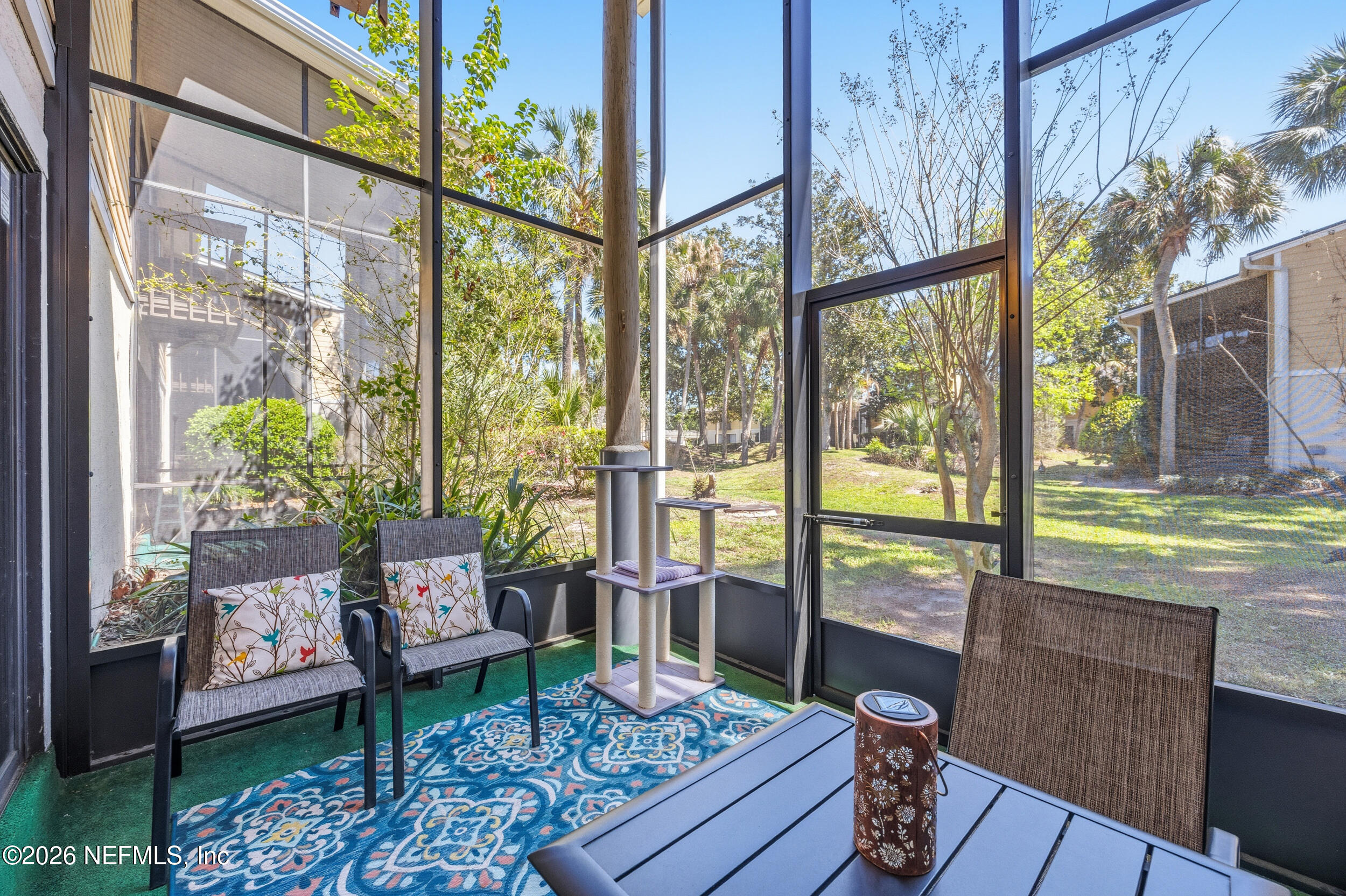 7852 Playa Del Rey Court Jacksonville, FL 32256 - Photo 25 of 33 a living room with large windows