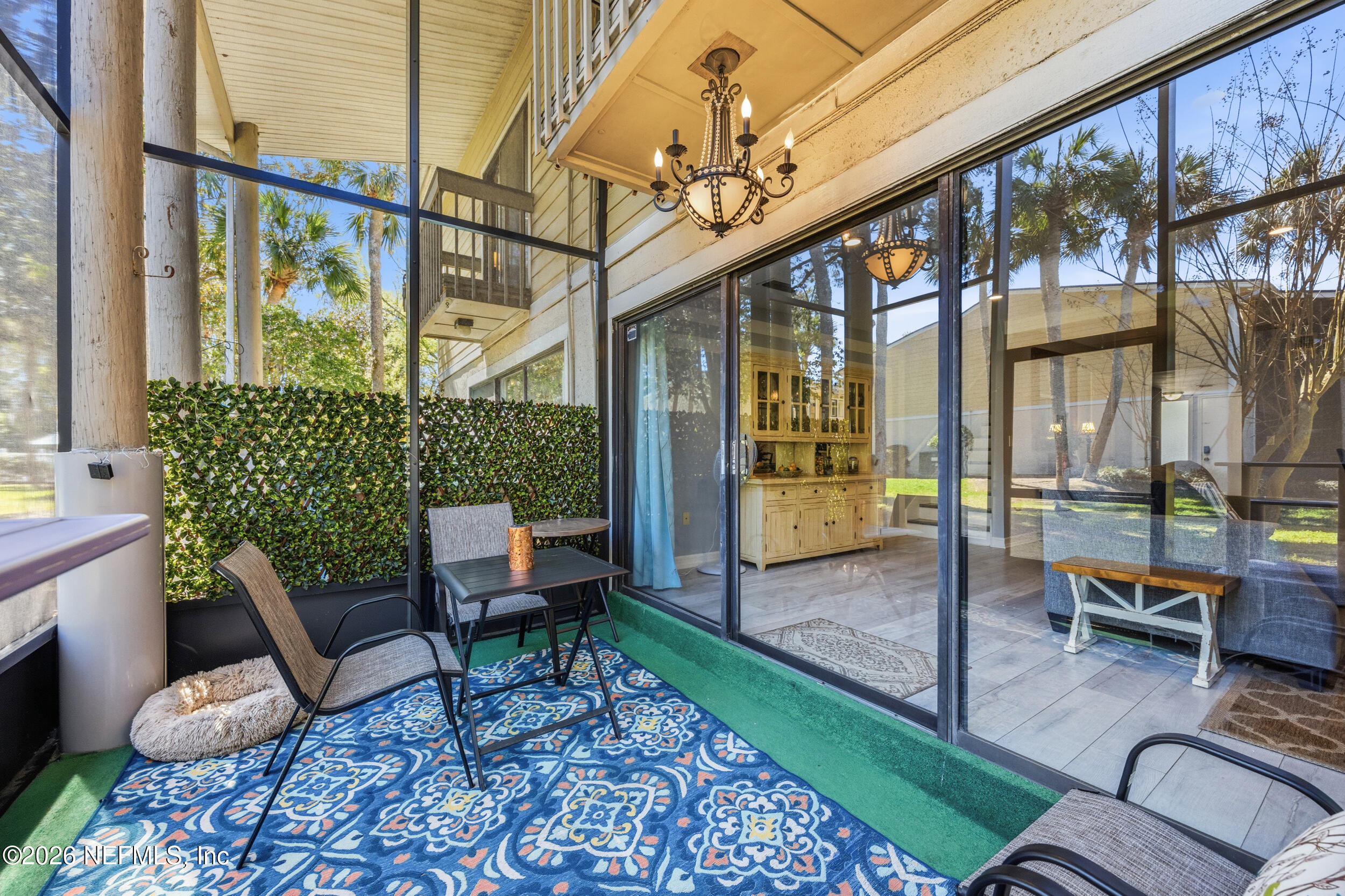 7852 Playa Del Rey Court Jacksonville, FL 32256 - Photo 26 of 33 a balcony with furniture and a potted plant
