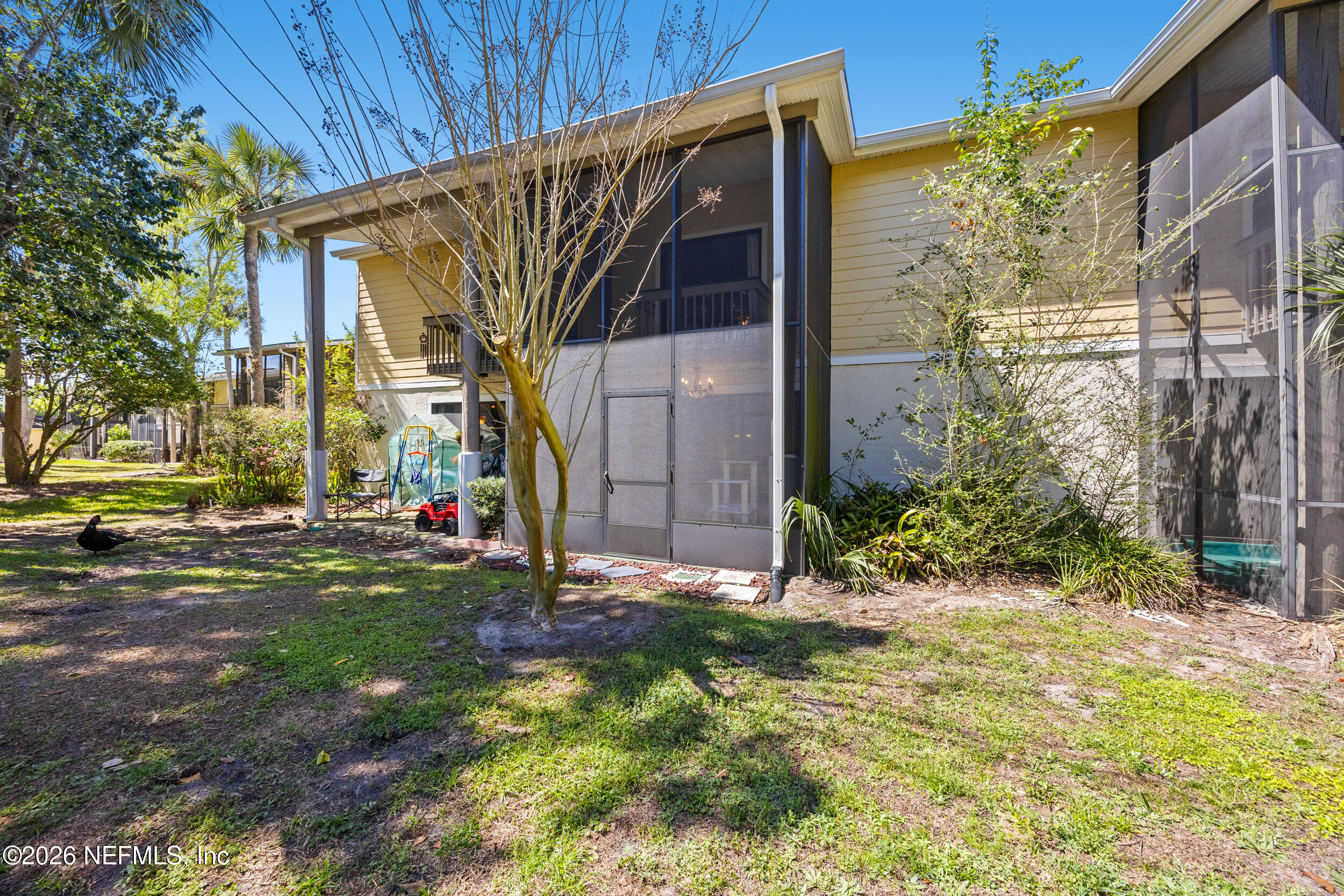 7852 Playa Del Rey Court Jacksonville, FL 32256 - Photo 27 of 33 a view of a house with a yard