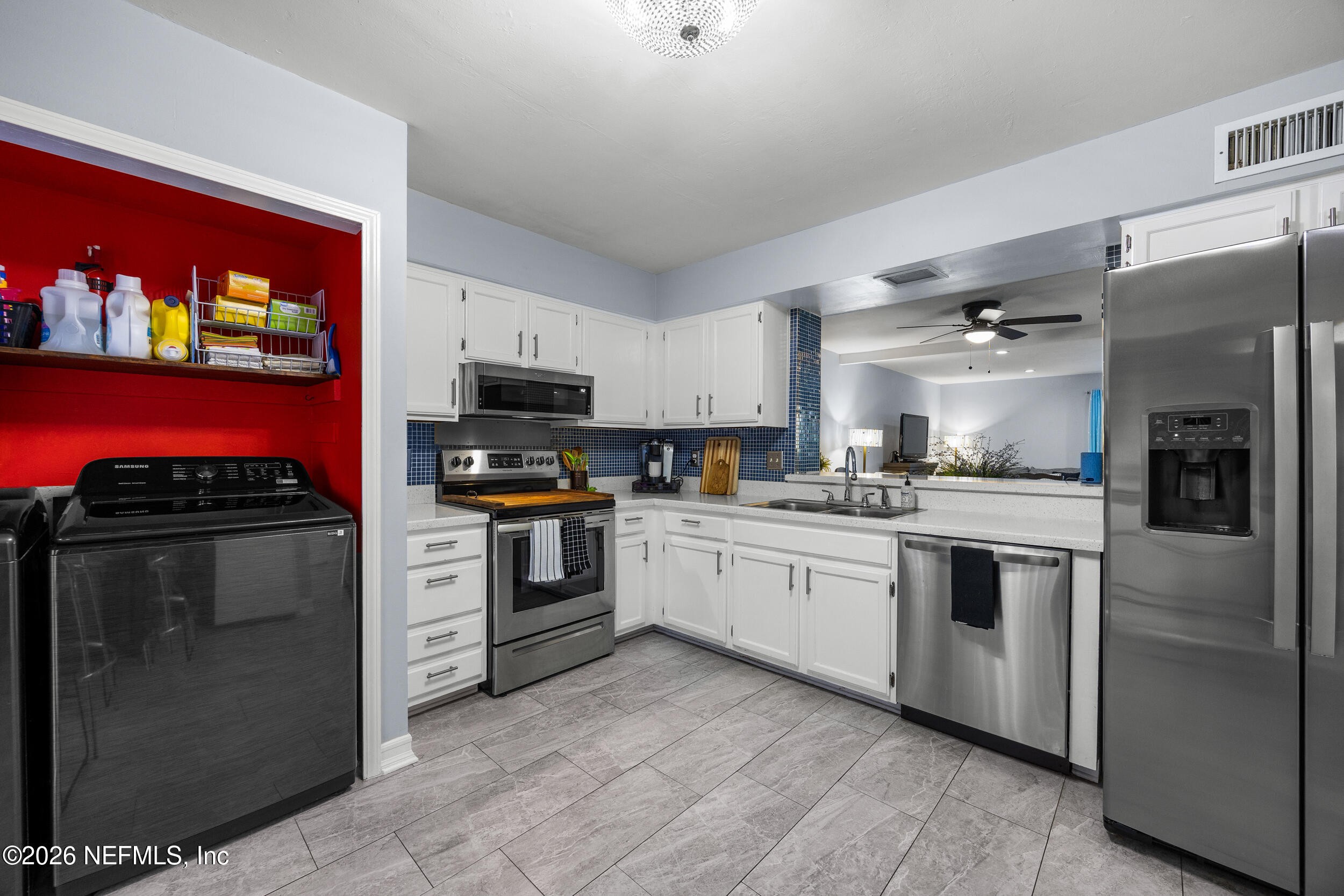 7852 Playa Del Rey Court Jacksonville, FL 32256 - Photo 6 of 33 a kitchen with stainless steel appliances granite countertop a refrigerator oven a sink and dishwasher