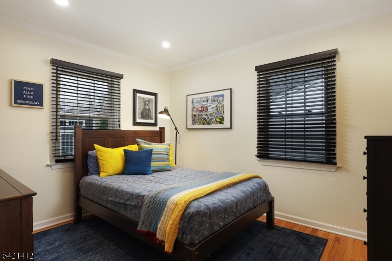 178 Tillotson Road Fanwood, NJ 07023 - Photo 12 of 38 a bedroom with a bed and a night stand