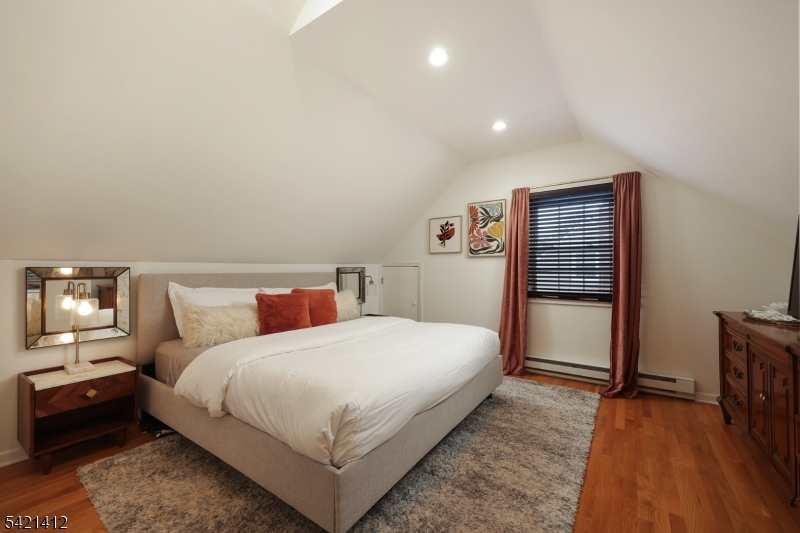 178 Tillotson Road Fanwood, NJ 07023 - Photo 14 of 38 a bedroom with a bed and a night stand