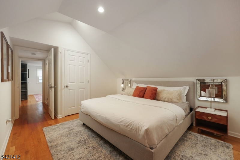 178 Tillotson Road Fanwood, NJ 07023 - Photo 15 of 38 a bedroom with a bed and a night stand