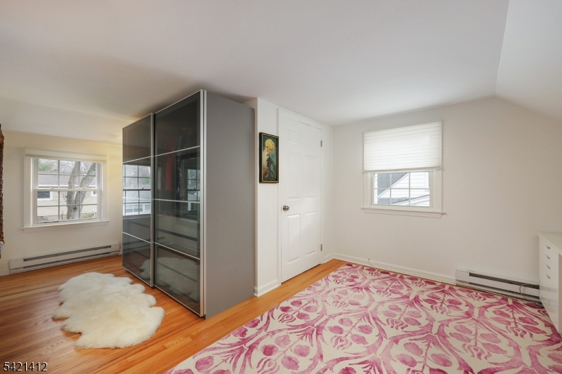 178 Tillotson Road Fanwood, NJ 07023 - Photo 19 of 38 a view of a bedroom with cabinet and a window